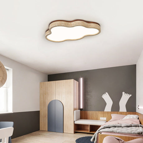 Cloud shaped ceiling light lit in a child bedroom with a gray wall and wood furniture