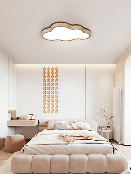 Cloud lamp ceiling fixture above a low bed in a bedroom with a beaded wall panel