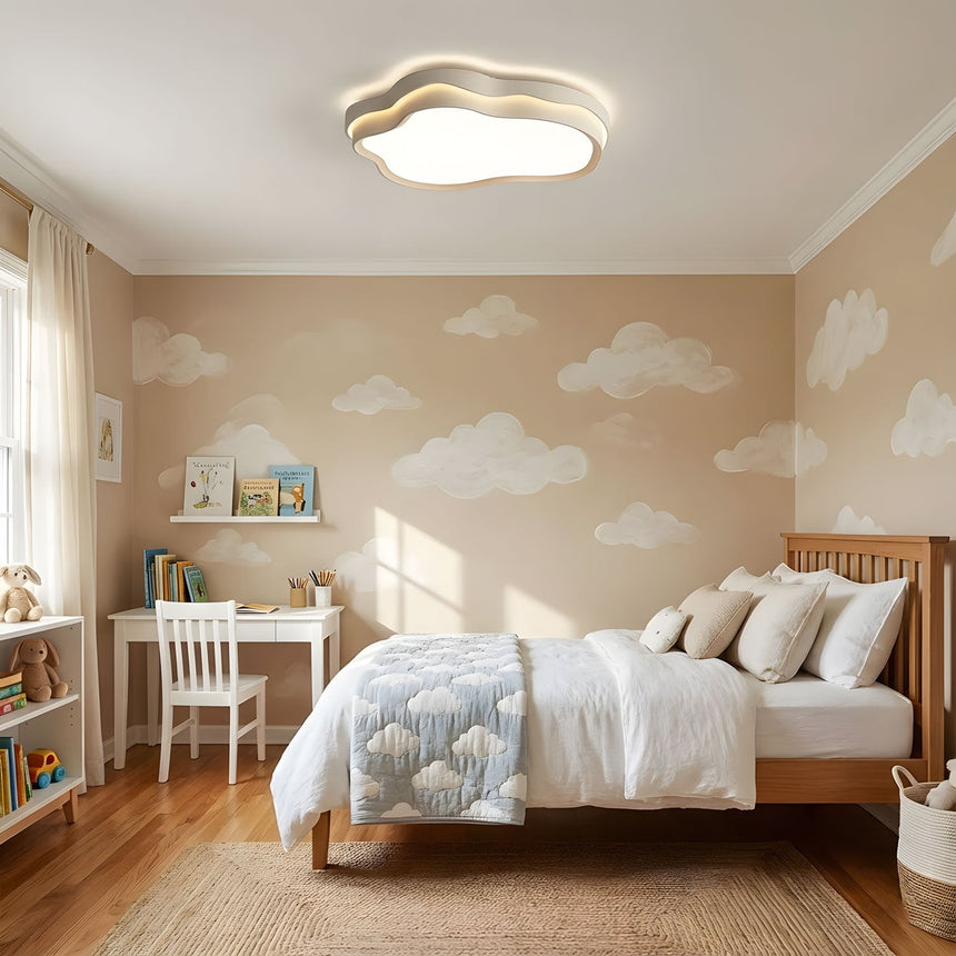 Layered cloud light fixture seen from below with the integrated LED glowing through the white diffuser