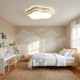 Cloud ceiling fixture above a kitchen island with light wood cabinets and a window beyond
