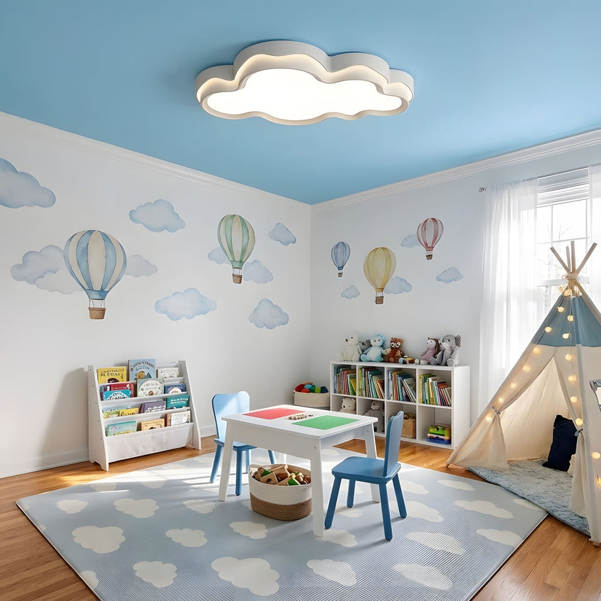 White cloud ceiling light in a bedroom above a headboard with bedside tables either side