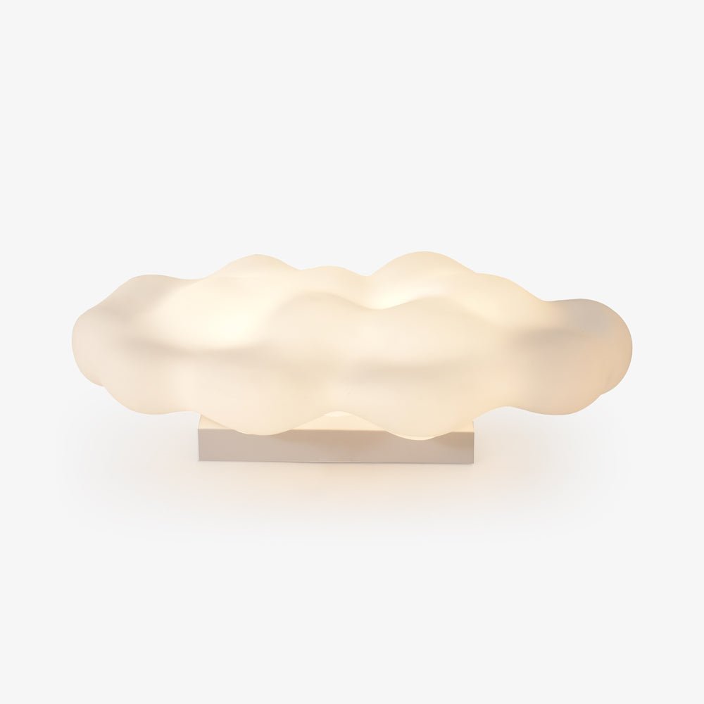 White cloud shaped light on a low base seen against a pale ground