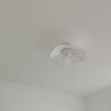 Unlit fabric wing ceiling fixture seen flat against a plain white ceiling