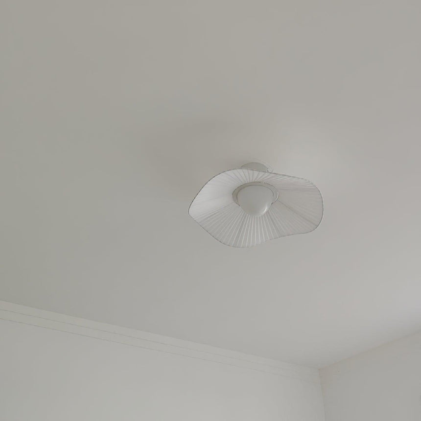 Unlit fabric wing ceiling fixture seen flat against a plain white ceiling
