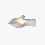 Fabric wing ceiling light lit at an angle on a plain studio background