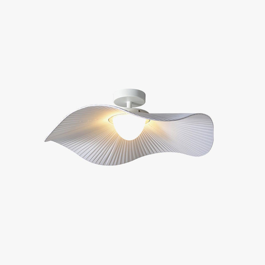 Fabric wing ceiling light lit at an angle on a plain studio background