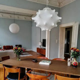Cloud shade hung above a long dining table