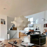 Cloud shade hung in a loft with pale walls