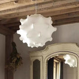 Layered imitation silk cloud shade hung in a pale room