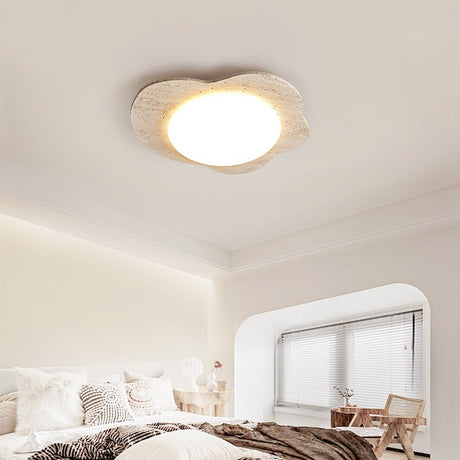 Cloud ceiling light in travertine seen from below in a bedroom with an arched window