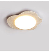 Travertine cloud ceiling fixture seen from the side showing its shallow depth