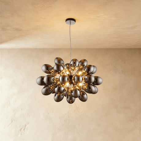 The mirrored cluster lit warm, each ovoid shade catching the light of its neighbor