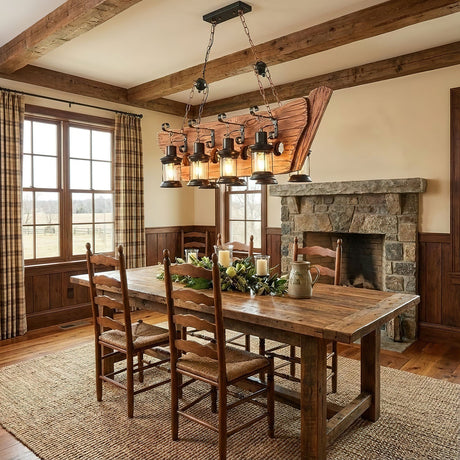 Chandelier lit above a wood dining table in a room with a fireplace