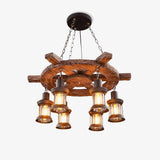 Coastal chandelier on a spoked wood ship wheel with six glass lanterns