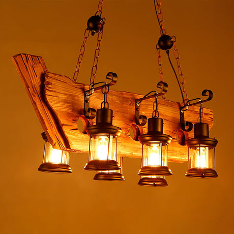 A long plank frame with several lanterns lit warm along its length