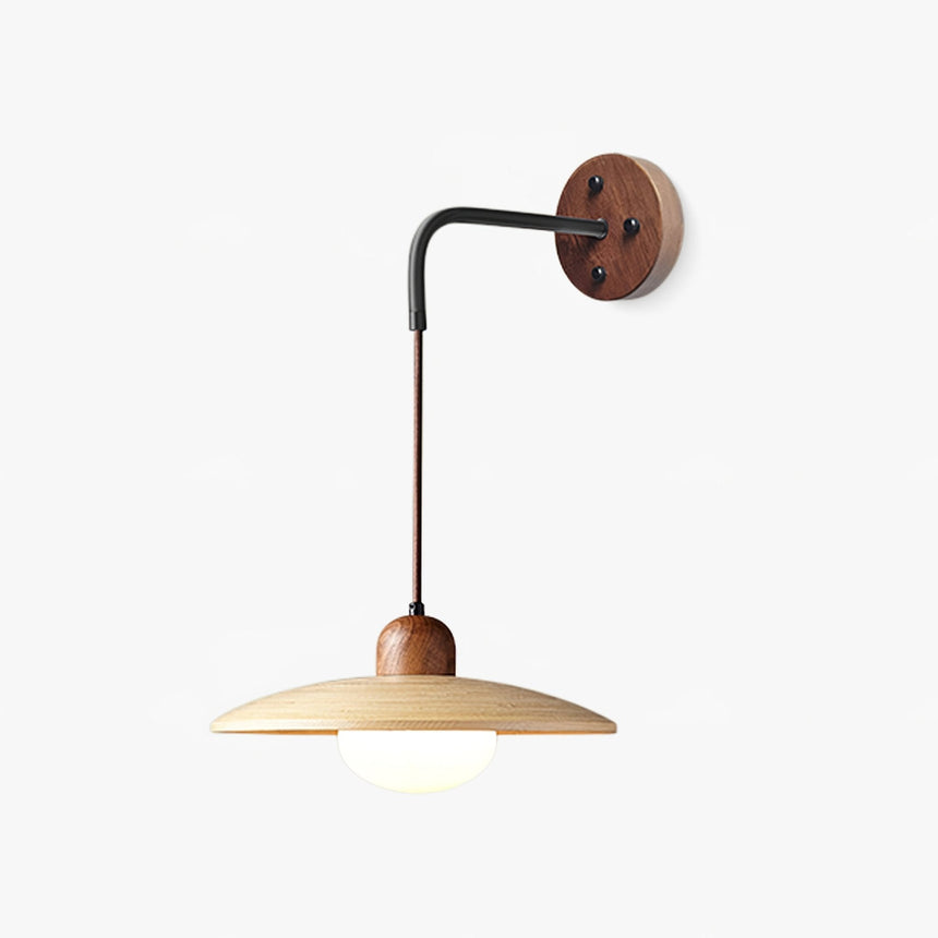Coastal wall sconce, a wide pale saucer shade on a black arm off a walnut disc