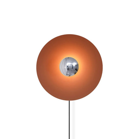 The orange disc with a chrome center and its cord on a white background