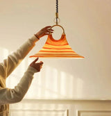 Close view of the brass ring holding the top of the glass cone