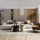 Tapered resin shade in a pale living room with a low sofa