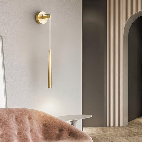 The brass cone beside an arched doorway above a pink tufted sofa