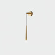 The brass finish on a pale gray background