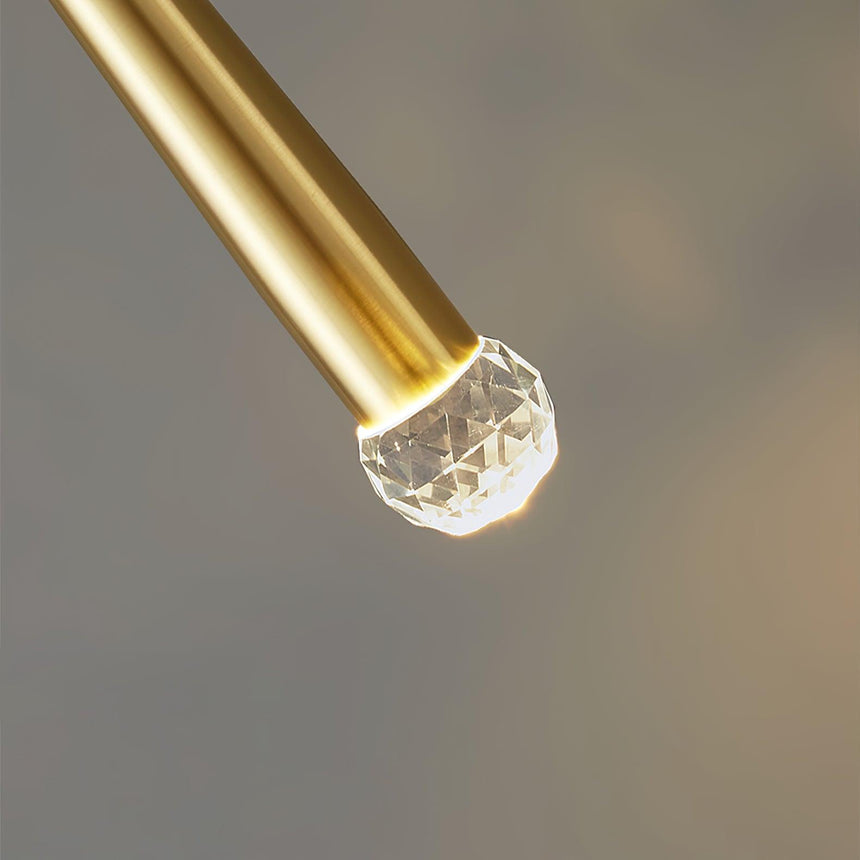 Close view of the faceted crystal at the tip of the brass cone
