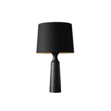Console table lamp in black with a black shade, lit and plain