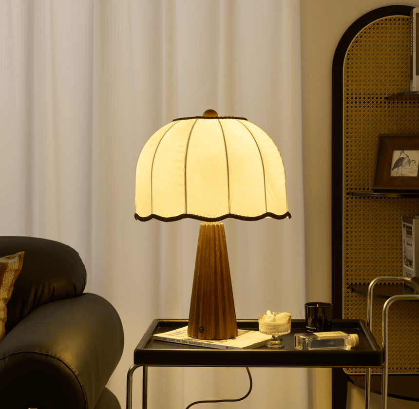 Close view of the lit scalloped shade above the fluted column