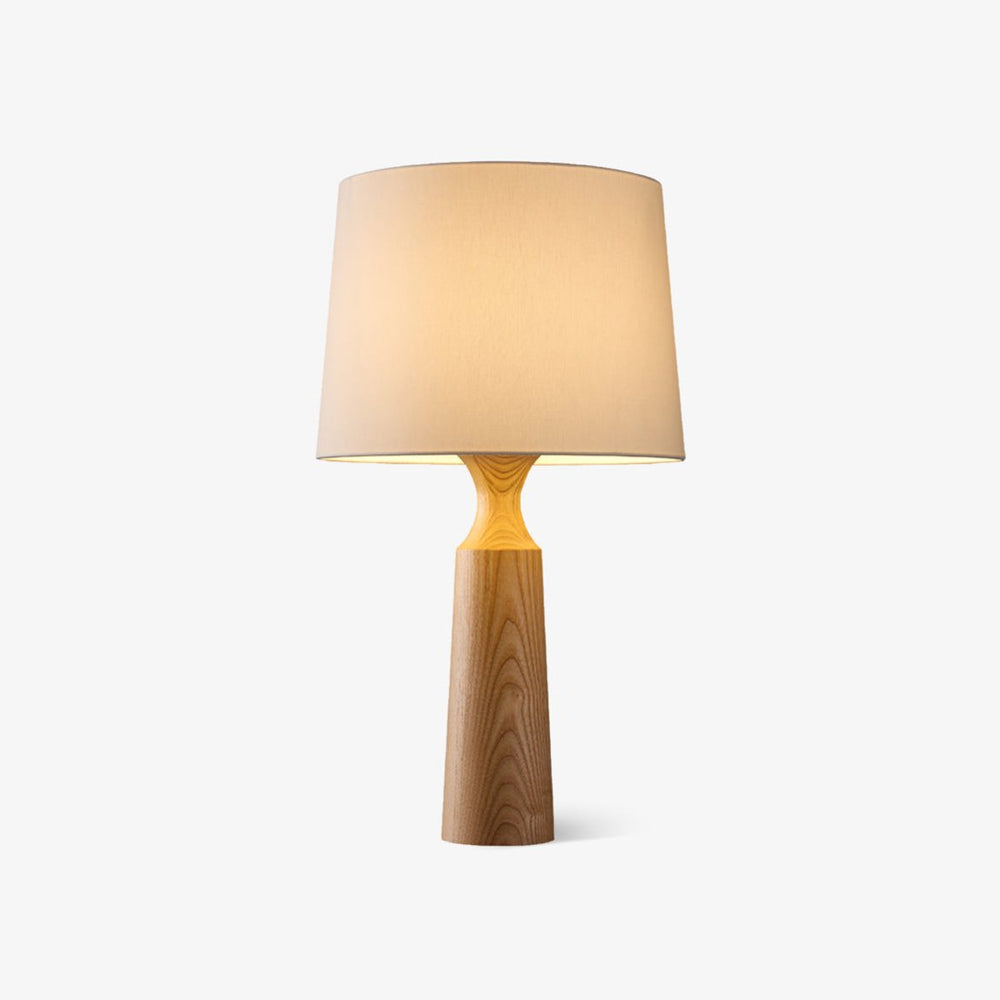 Console table lamp in light wood with a white shade on a plain ground