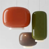 Orange, green and brown glass shades photographed together