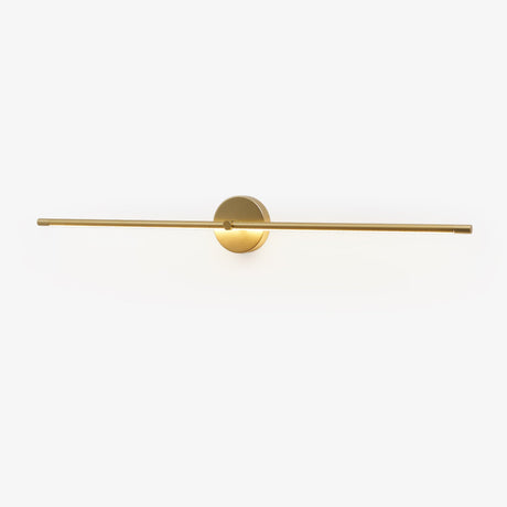 Slim gold rod crossing a round gold hub on a plain wall plate