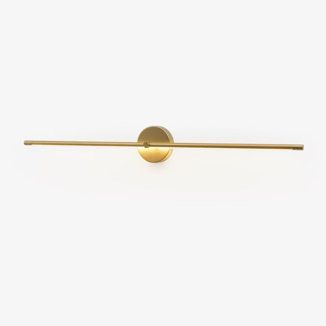 Slim gold rod crossing a round gold hub on a plain wall plate
