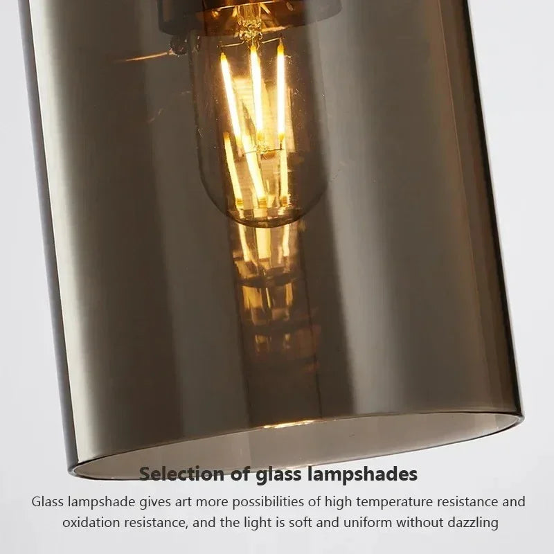 Close view of the filament bulb glowing inside the smoked glass tube