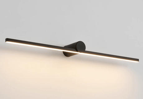 The black bar lit at an angle, a continuous line of light along its underside