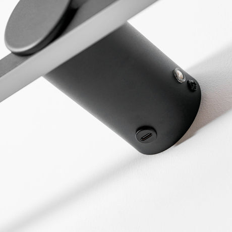 Close view of the round mount and the charging port on the back of the bar