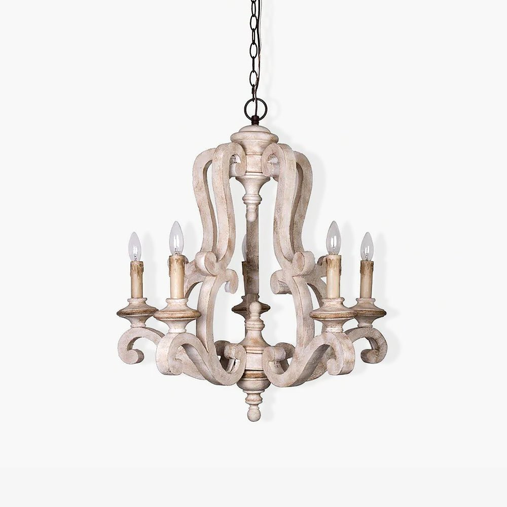 A carved wood frame of scrolls and spindles carrying five candle lamps on curved arms