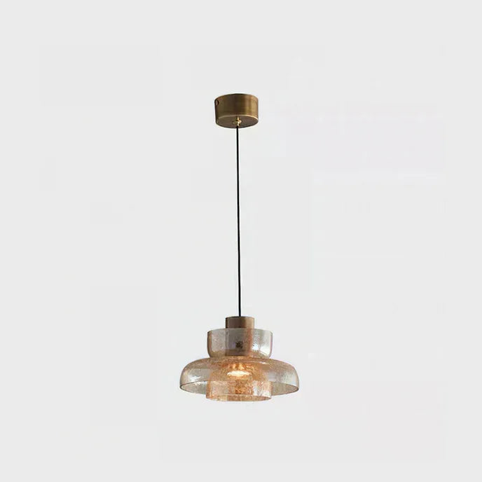 The amber crackle glass shade seen alone on a plain pale background
