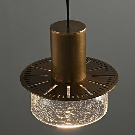 The fluted underside of the brass cap seen against a dark background