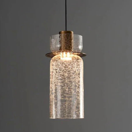 A tall clear crackle cylinder lit showing the brass holder inside it
