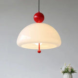 Close view of the cream dome and the red ball fitting above it
