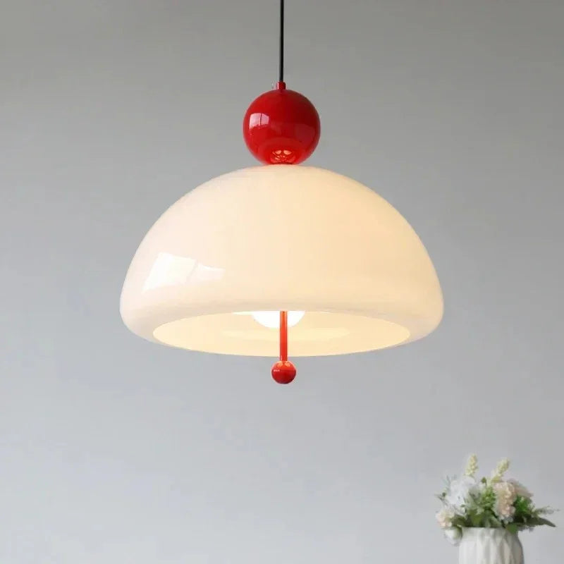 Close view of the cream dome and the red ball fitting above it