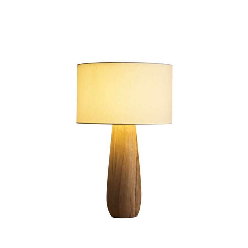 Cream table lamp on a light natural wood base, plain ground