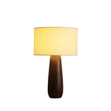 Cream table lamp on a walnut toned wood base, plain ground