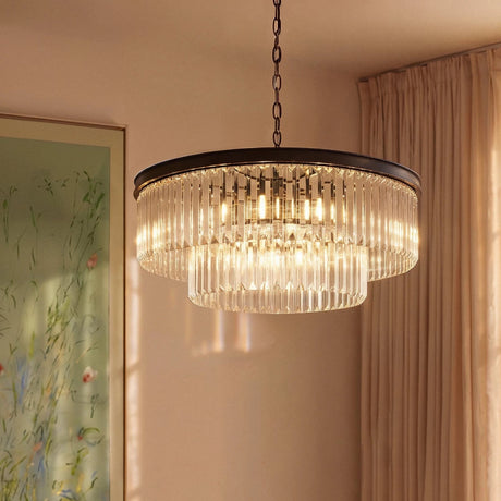 The round black version lit beside a long curtain and a framed artwork