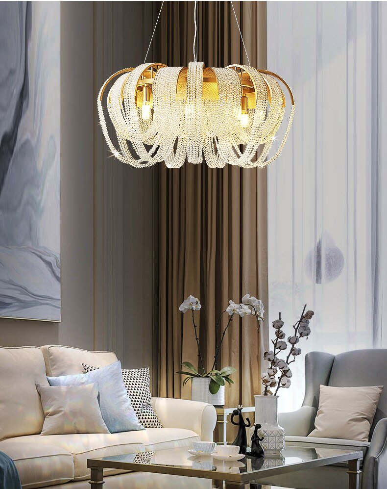 The round version lit in a living room above a pale sofa and a glass table