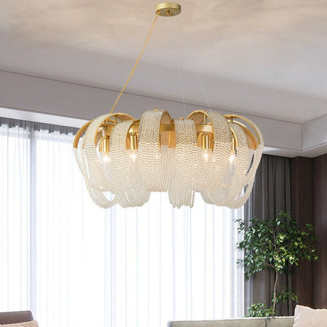 The round version lit in a room with long curtains and a tall green plant
