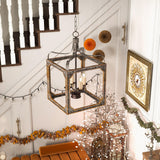 Hung beside a staircase above a console dressed with autumn decorations
