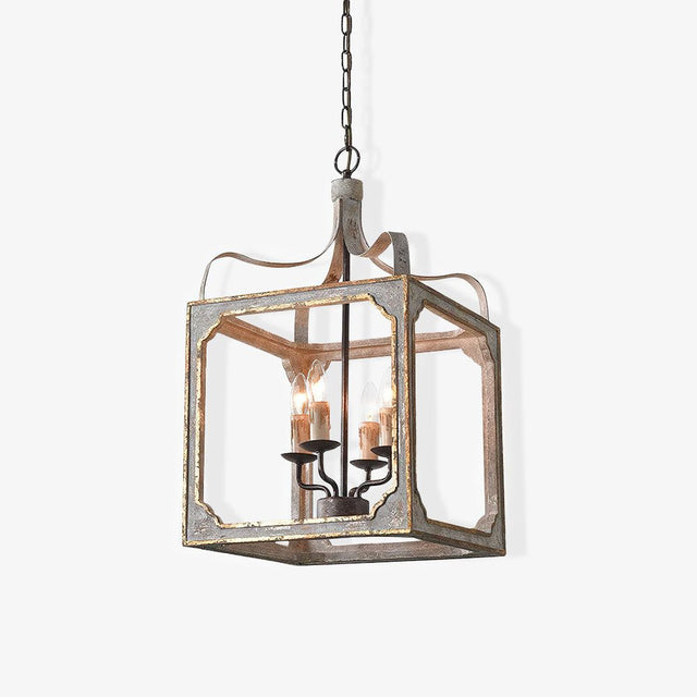 A washed wood cube frame with metal corners holding four candle lamps inside