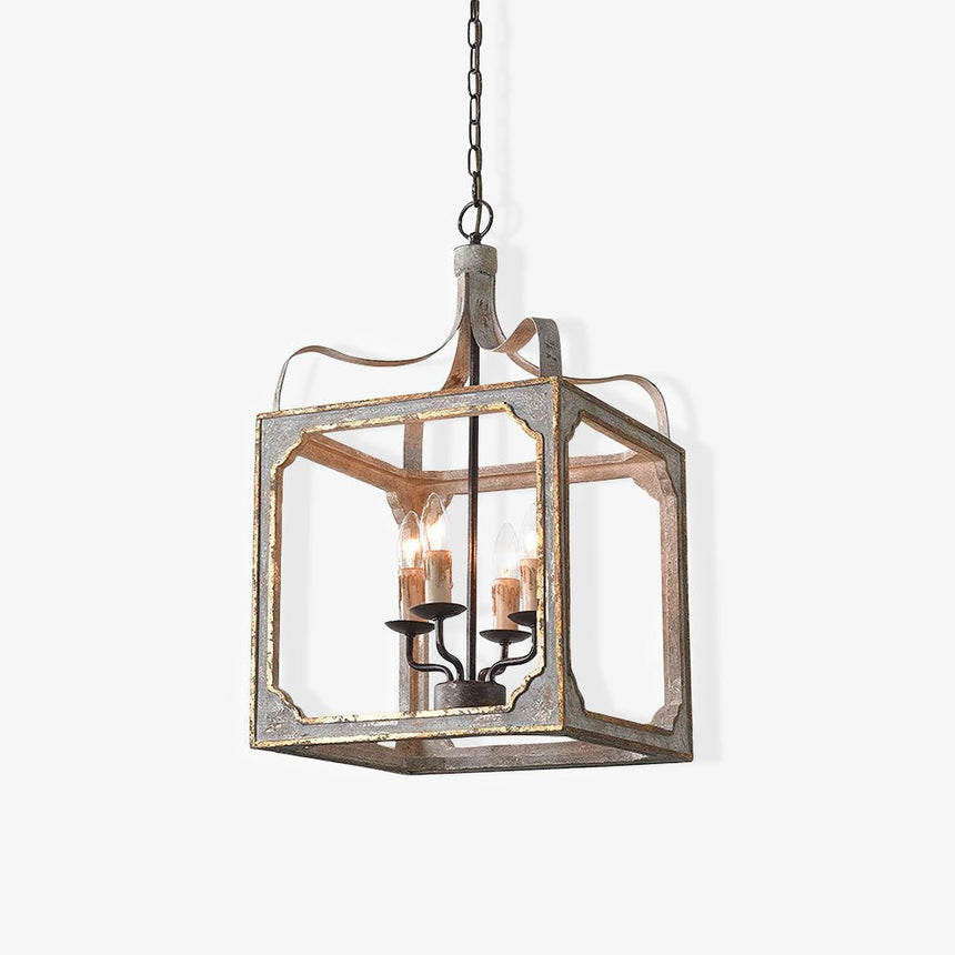 A washed wood cube frame with metal corners holding four candle lamps inside