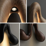 Detail views of the curve, the opening underneath and the lit source